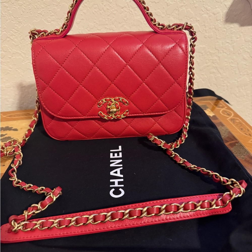 Chanel Infinity Chain mini bag in red quilted leather.